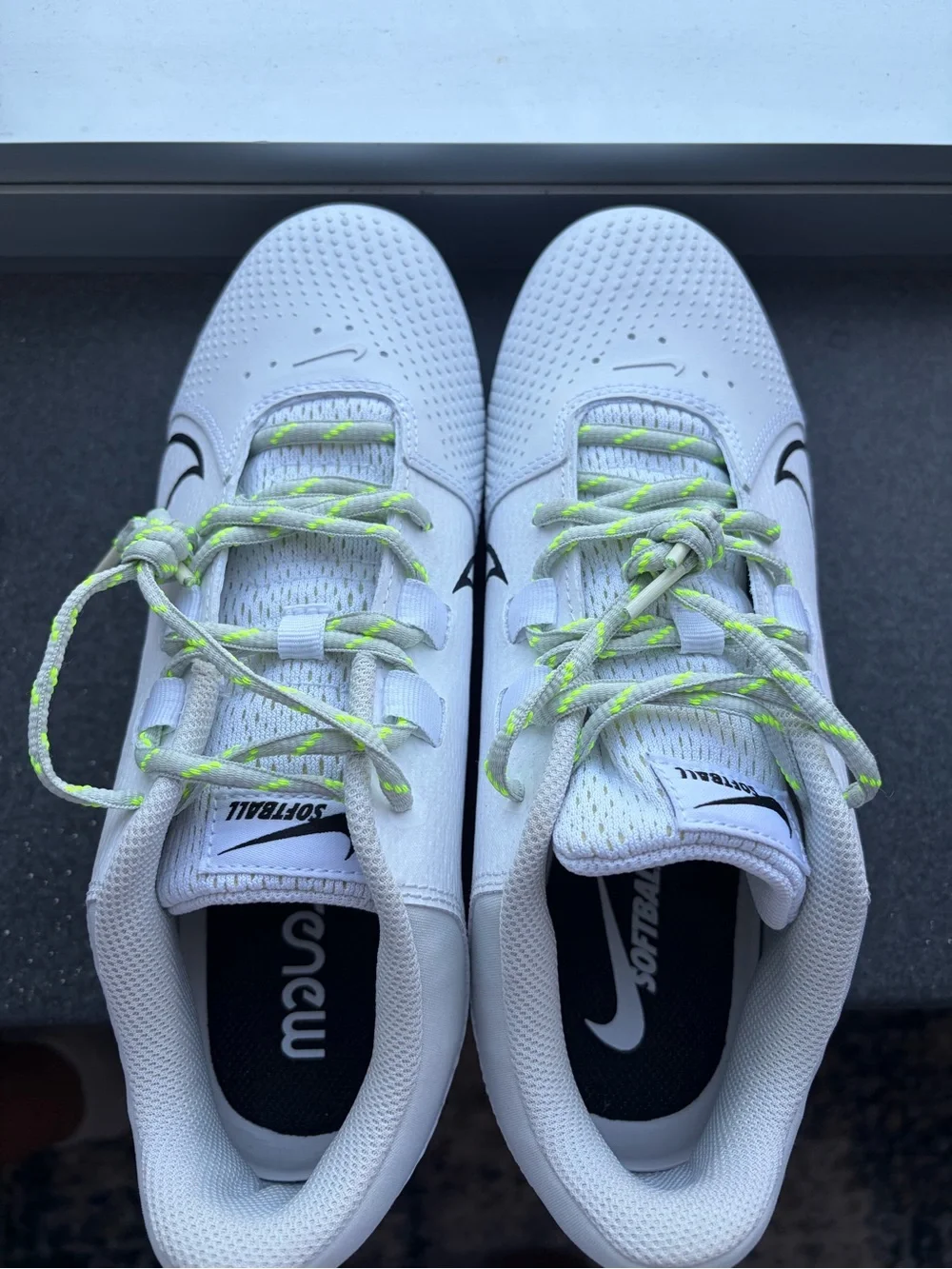 Nike Renew Softball Cleats with Black Swoosh and Neon Green Laces